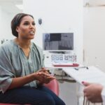patient talking to dentist about loose crown